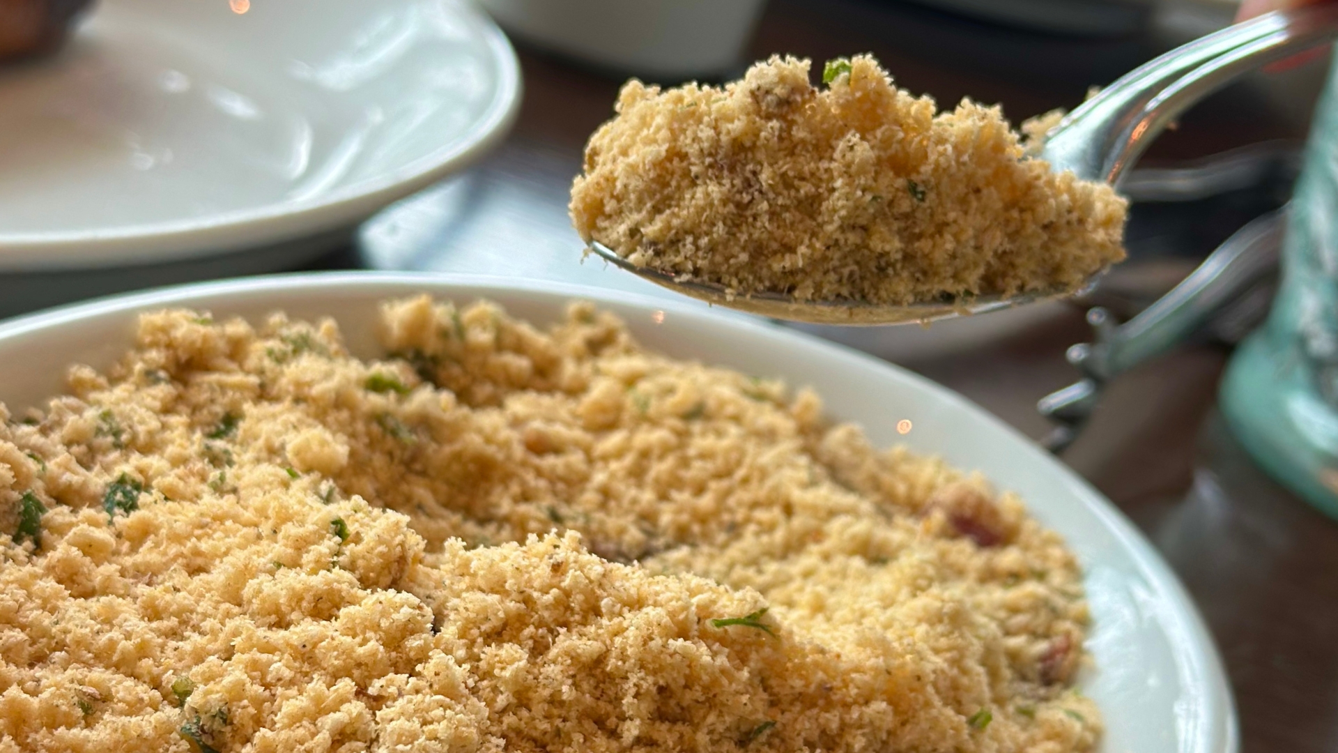 Traditional Brazilian farofa served alongside churrasco at Estância Brazilian Steakhouse