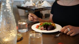Guests enjoying tableside churrasco at Estância Brazilian Steakhouse
