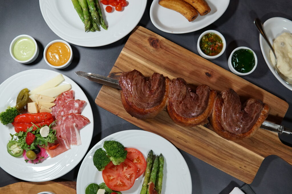 Brazilian steakhouse lunch and dinner with fire-roasted churrasco and Gourmet Salad Bar selections at Estância